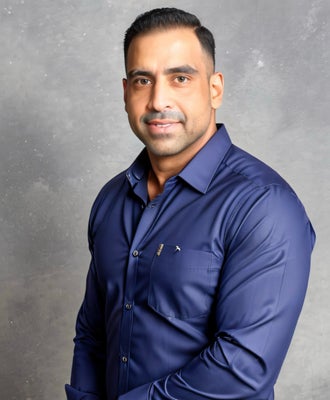 Portrait of Rahim Hemraj, DREAM Home Realtor.
